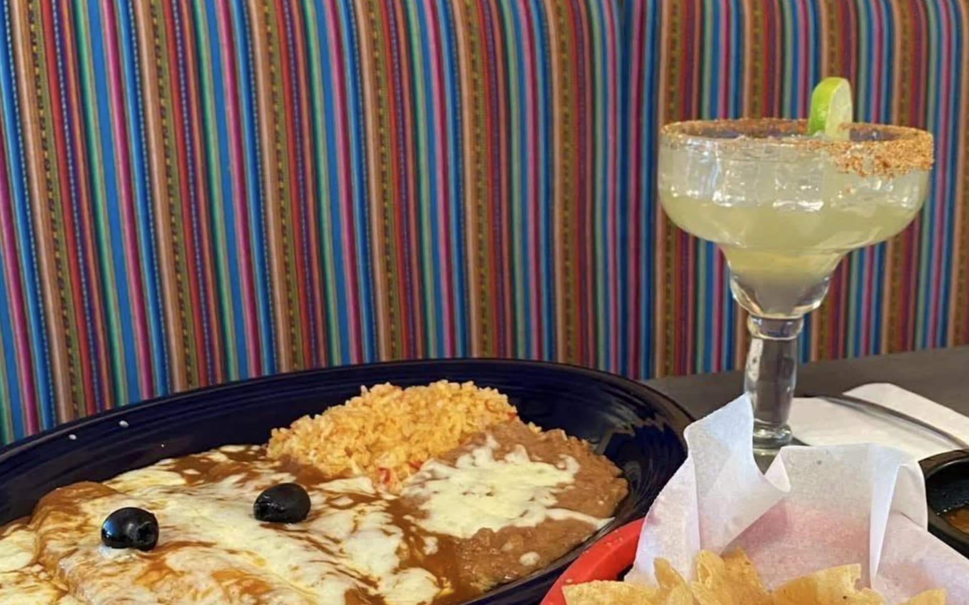 El Charro plate with enchilada, rice, beans, and margarita