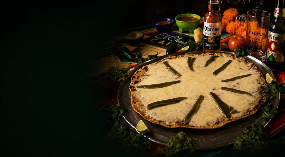 Toasted cheese with green chiles on an El Charro table